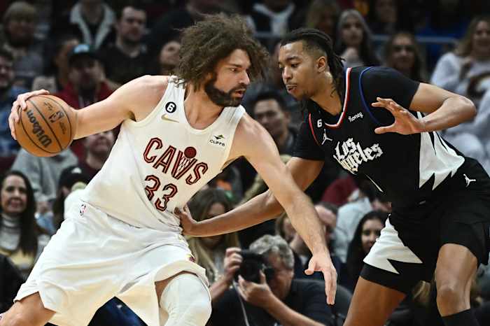 Jan 29, 2023; Cleveland, Ohio, USA; Cleveland Cavaliers center Robin Lopez (33) drives to the basket against Los Angeles Clippers center Moses Brown (9) during the second half at Rocket Mortgage FieldHouse. Mandatory Credit: Ken Blaze-USA TODAY Sports
